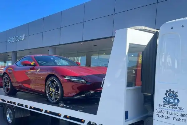 prestige car on a tow truck
